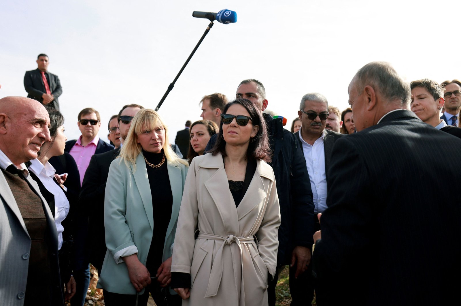 German Foreign Minister Annalena Baerbock (Center) meets with villagers during her visit to al-Mazraa ash-Sharqiya village near the city of Ramallah in the occupied West Bank on Jan. 8, 2024. (AFP Photo)