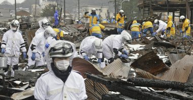 Emergency workers conduct a search operation in Wajima, Ishikawa prefecture, Japan, Jan. 9, 2024. (AP Photo)
