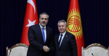 Foreign Minister Hakan Fidan (L) shakes hands with his Kyrgyz counterpart Zheenbek Kulubaev before their news conference, Bishkek, Kyrgyzstan, Jan. 9, 2024. (AA Photo)