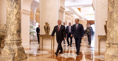 A handout picture released by the Jordanian Royal Palace shows Jordan's King Abdullah II (L) walking alongside Egypt's President Abdel Fattah el-Sissi in Cairo on Dec. 27, 2023. (Photo by Jordanian Royal Palace via AFP)