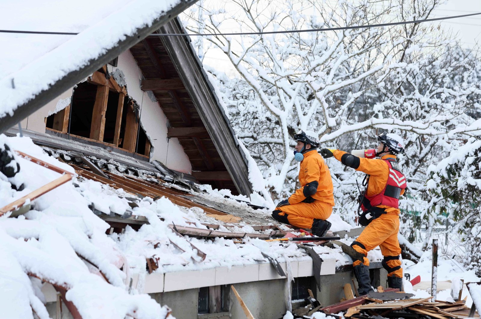 Firefighters search for missing persons after a powerful earthquake struck the region in Suzu, Ishikawa Prefecture, Japan, Jan. 8, 2024. (EPA Photo)