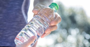 Tiny plastic particles in water bottles are so small they can get inside cells and even be passed from mother to child in the womb, researchers say. (dpa Photo)