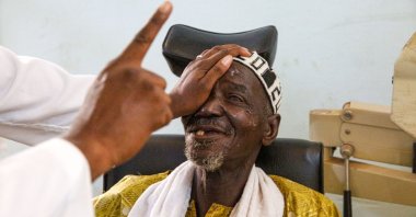 An African man shares a smile after his successful surgery by IHH, Jan. 10, 2023. (DHA photo)