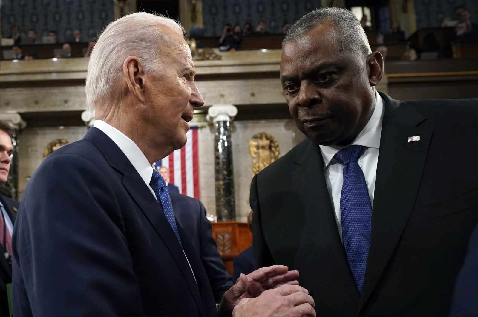U.S. President Joe Biden (L) speaks to Defense Secretary Lloyd Austin at the US Capitol in Washington, D.C., U.S., Feb. 7, 2023. (Getty Images)