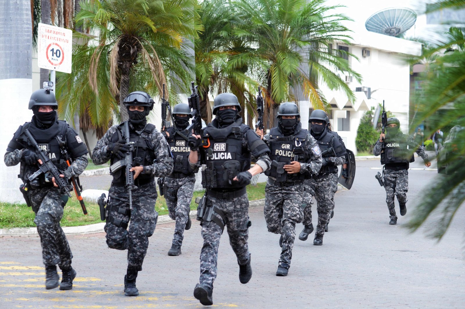 An Ecuadorean police squad enters the premises of Ecuador&#039;s TC television channel, Guayaquil, Ecuador, Jan. 9, 2024. (AFP Photo)