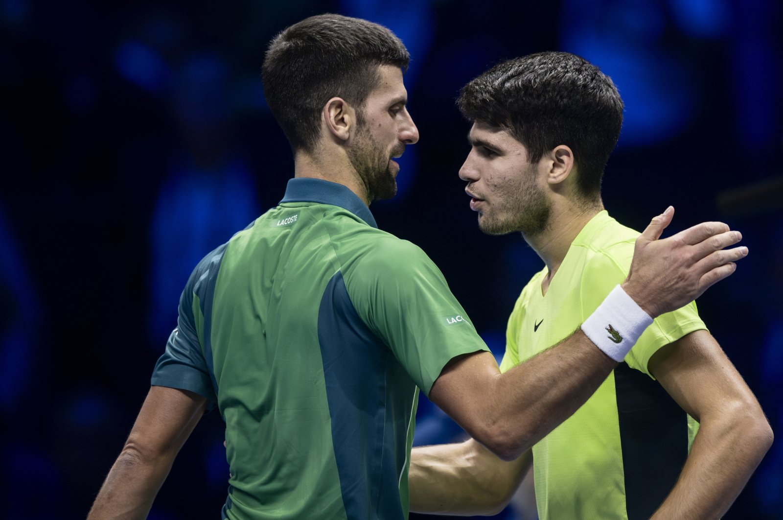 Novak Djokovic (L) of Serbia hugs Carlos Alcaraz of Spain at the end of the semifinal singles match during day seven of the Nitto ATP Finals, Turin, Italy, Nov. 18, 2023. (Getty Images Photo)