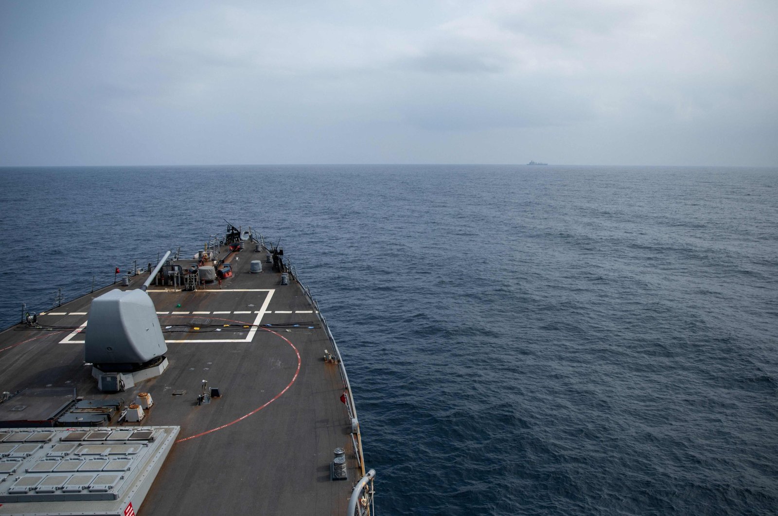 In this image obtained from the U.S. Department of Defense, the Arleigh Burke-class guided-missile destroyer USS Laboon approaches the oiler USNS Kanawha (background) for replenishment-at-sea operation in the Red Sea on Dec.25, 2023. (AFP Photo)