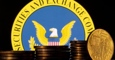 U.S. Securities and Exchange Commission logo and representations of cryptocurrency are seen in this illustration taken June 6, 2023. (Reuters Photo)
