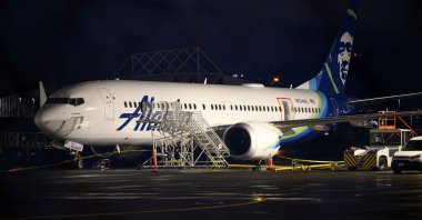 A plastic sheet covers an area of the fuselage of the Alaska Airlines N704AL Boeing 737 Max 9 aircraft at Portland International Airport, Portland, Oregon, U.S., Jan. 8, 2024. (AFP Photo)