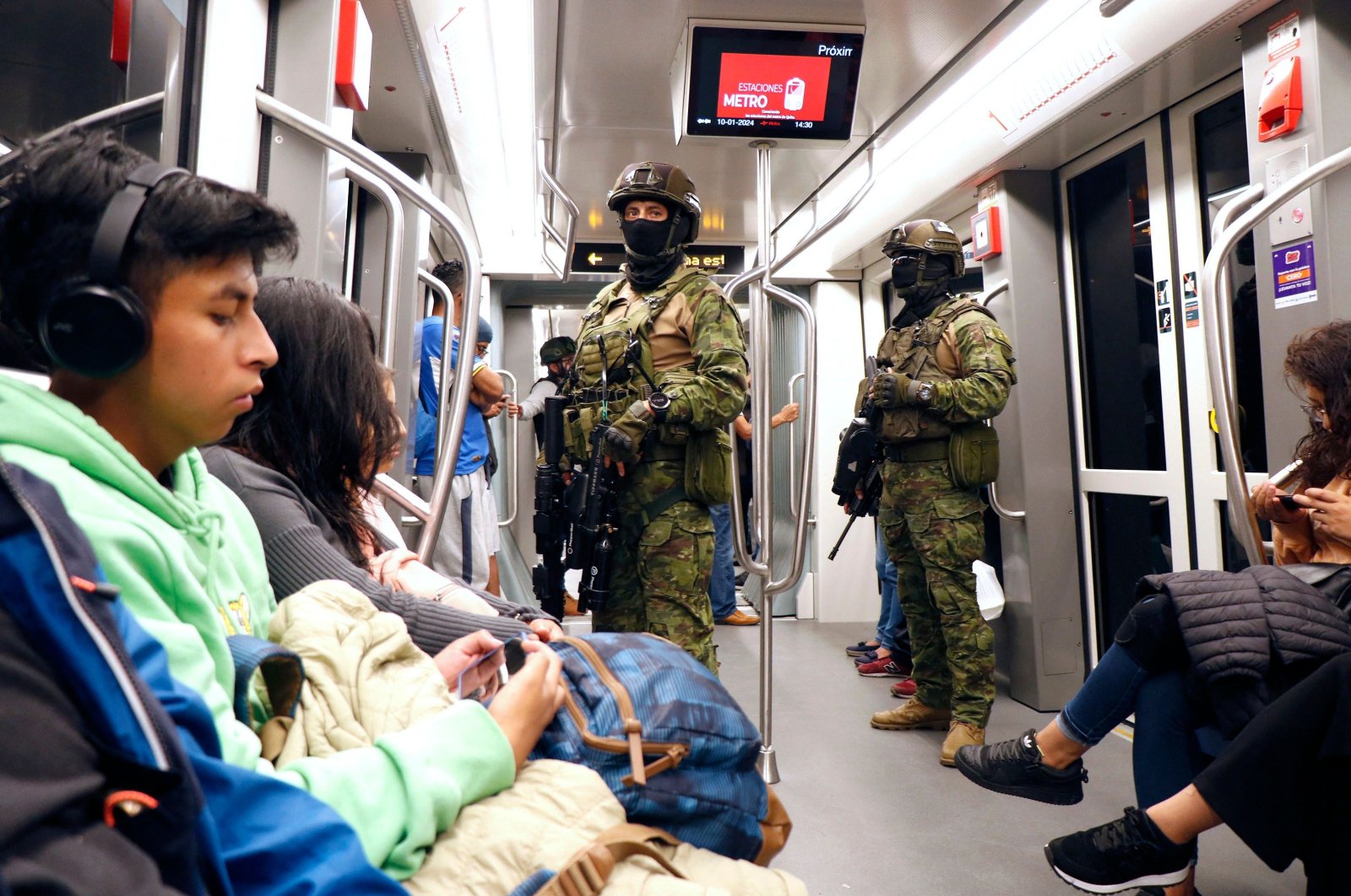 Ecuadorian troops stand guard at a subway car during an operation to protect civil security in Quito, Ecuador, Jan. 10, 2024. (AFP Photo)