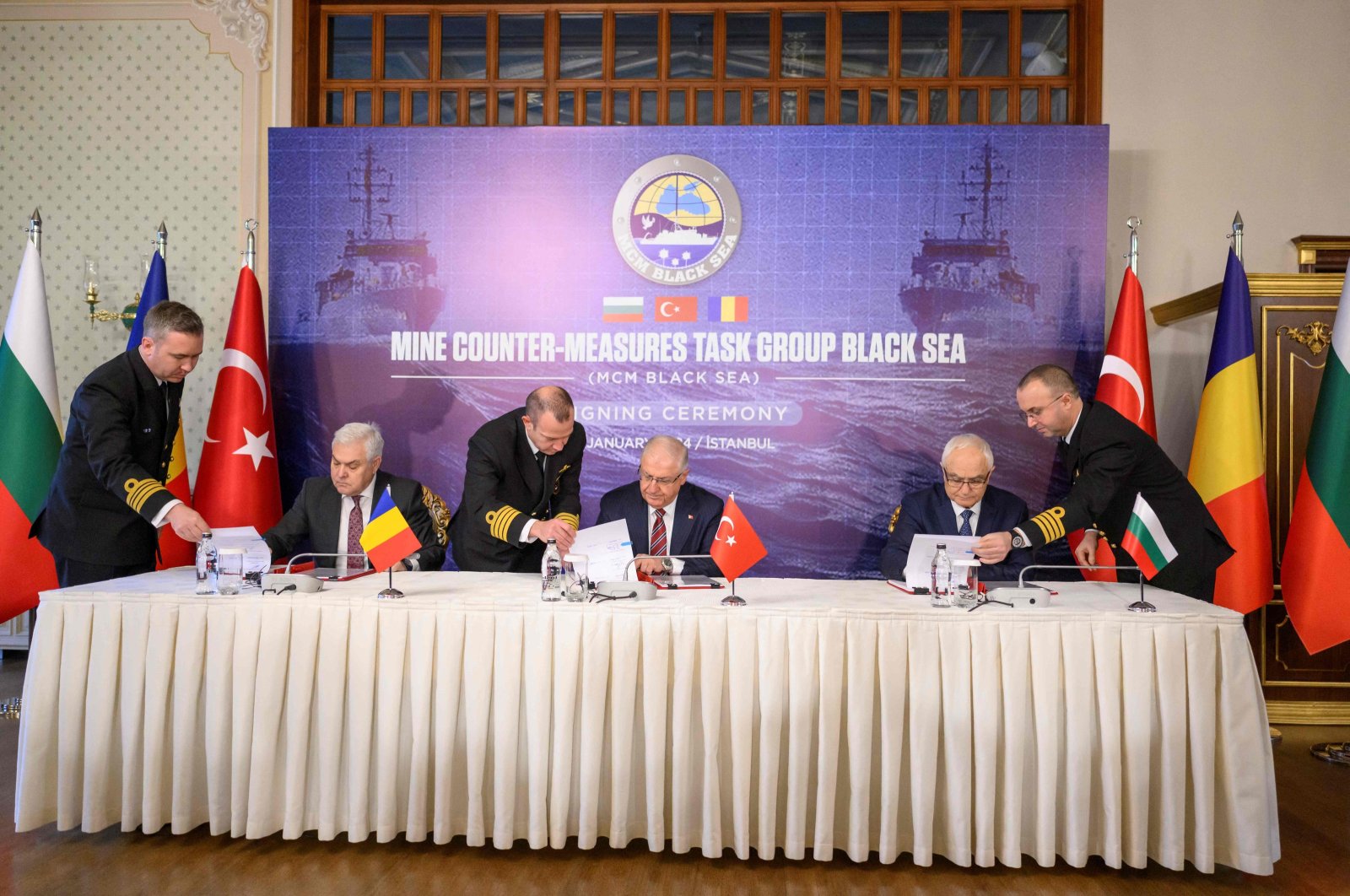 Romanian Defense Minister Angel Tilvar (L), Defense Minister Yaşar Güler (C) and Bulgaria&#039;s Deputy Defense Minister Atanas Zapryanov (R) sign the demining agreement, Istanbul, Türkiye, Jan. 11, 2024. (AFP Photo)