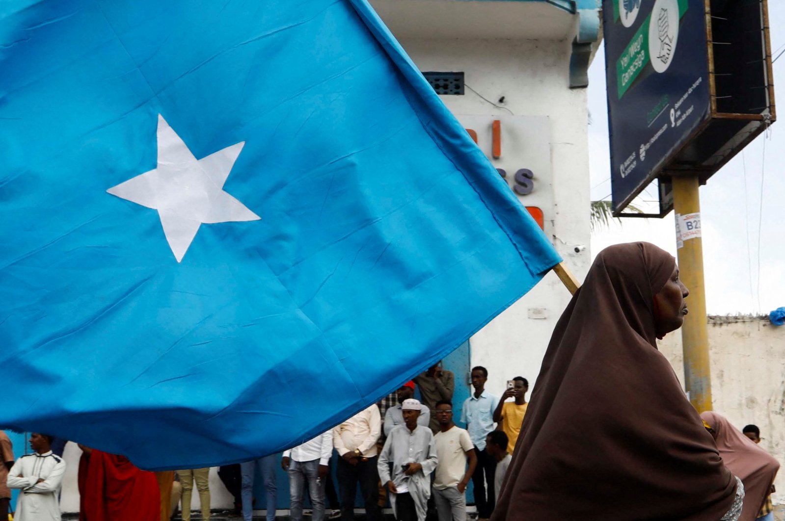 A Somali woman carries their flag during a march against the Ethiopia-Somaliland port deal along KM4 street in Mogadishu, Somalia, Jan. 11, 2024. (Reuters Photo)