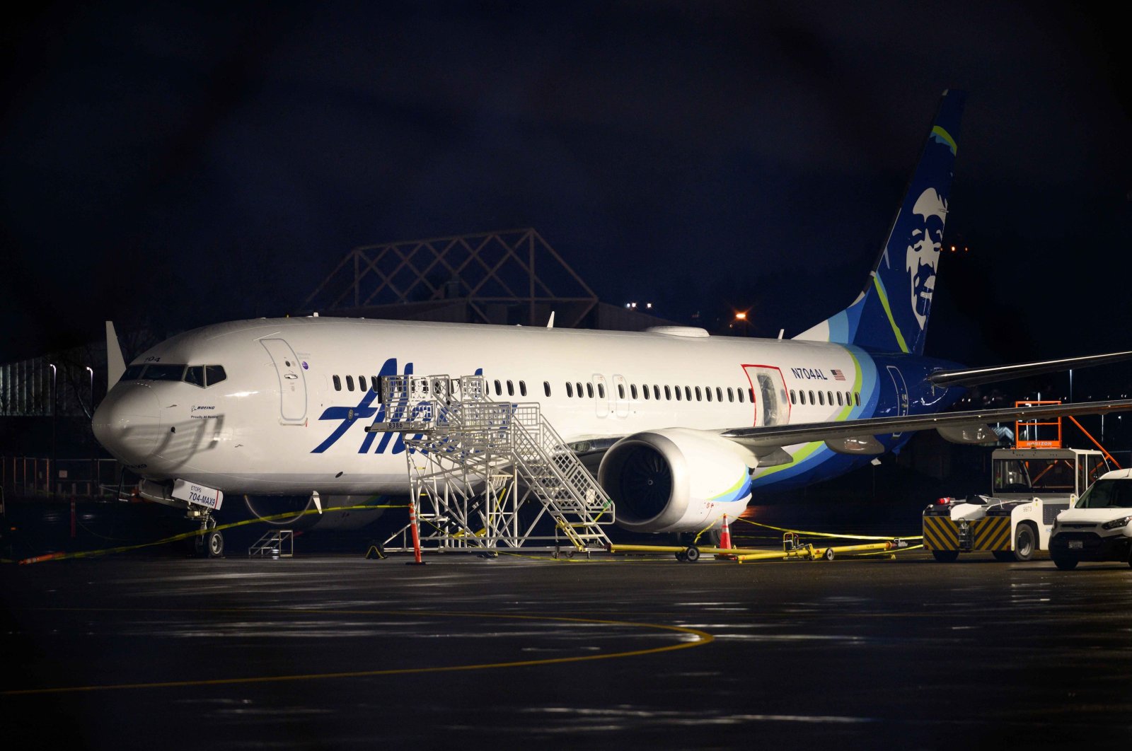 A plastic sheet covers an area of the fuselage of the Alaska Airlines N704AL Boeing 737 Max 9 aircraft at Portland International Airport, Portland, Oregon, U.S., Jan. 8, 2024. (AFP Photo)