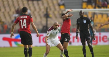 Morocco's Sofyan Amrabat (C) and Egypt's Mohamed Salah during the African Cup of Nations at Ahmadou Ahidjo Stadium, Yaounde, Cameroon, Jan. 30, 2022. (Getty Images Photo)
