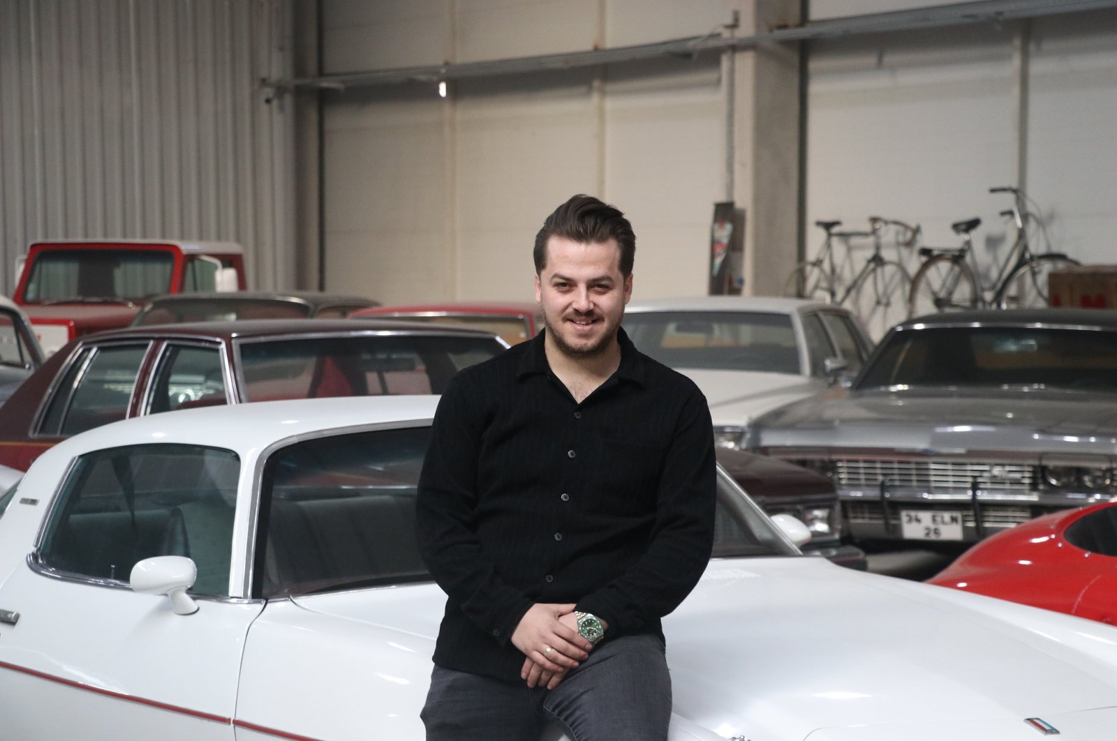 Car enthusiast Ahmet Taha Göktaş, who has a collection of 29 classic cars, takes meticulous care of them in the hangar named &quot;Rusty Garage&quot; located in the Mimar Sinan Organized Industrial Zone, Kayseri, Türkiye. (AA Photo)