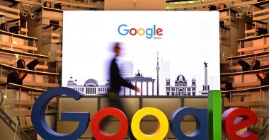 A technician passes by the logo of U.S. internet search giant Google during the opening day of a new office in Berlin, Germany, Jan. 22, 2019. (AFP File Photo)