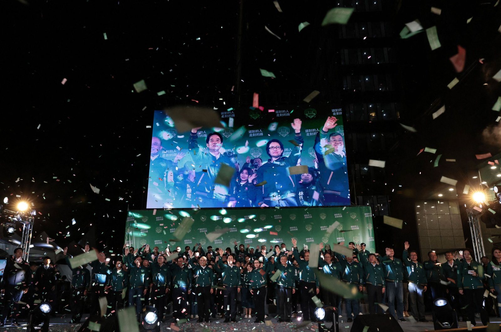 A display shows Taiwan&#039;s President-elect Lai Ching-te (L) and his running mate Hsiao Bi-khim attending a rally outside the headquarters of the Democratic Progressive Party (DPP) in Taipei on Jan. 13, 2024. (AFP Photo)