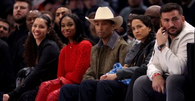 U.S. musician Pharrell Williams (C) attends the NBA regular season basketball match between the Cleveland Cavaliers and the Brooklyn Nets at the Accor Arena, Paris, France, Jan. 11, 2024. (AFP Photo)