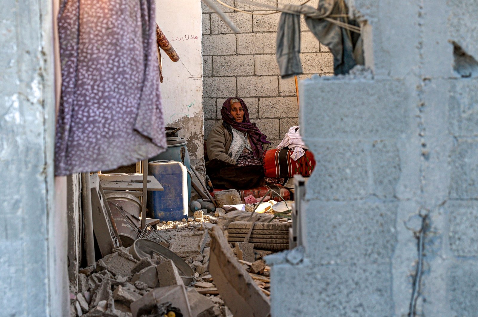 A woman sits in a damaged house following Israeli bombardment in Rafah, southern Gaza Strip, Palestine, Jan. 13, 2024. (AFP Photo)