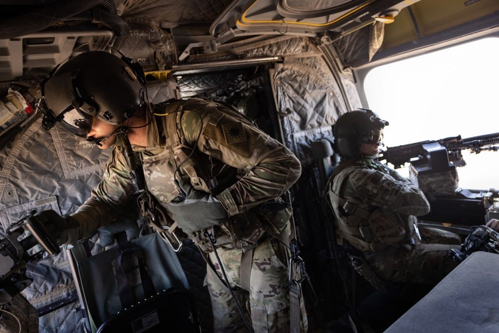 U.S. Army CH-47 Chinook helicopter gunners scan the desert over northeastern Syria, May 26, 2021. (Getty Images)