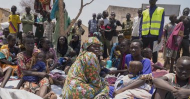 South Sudanese who fled from Sudan sit outside a nutrition clinic at a transit center in Renk, South Sudan, May 16, 2023. (AP Photo)