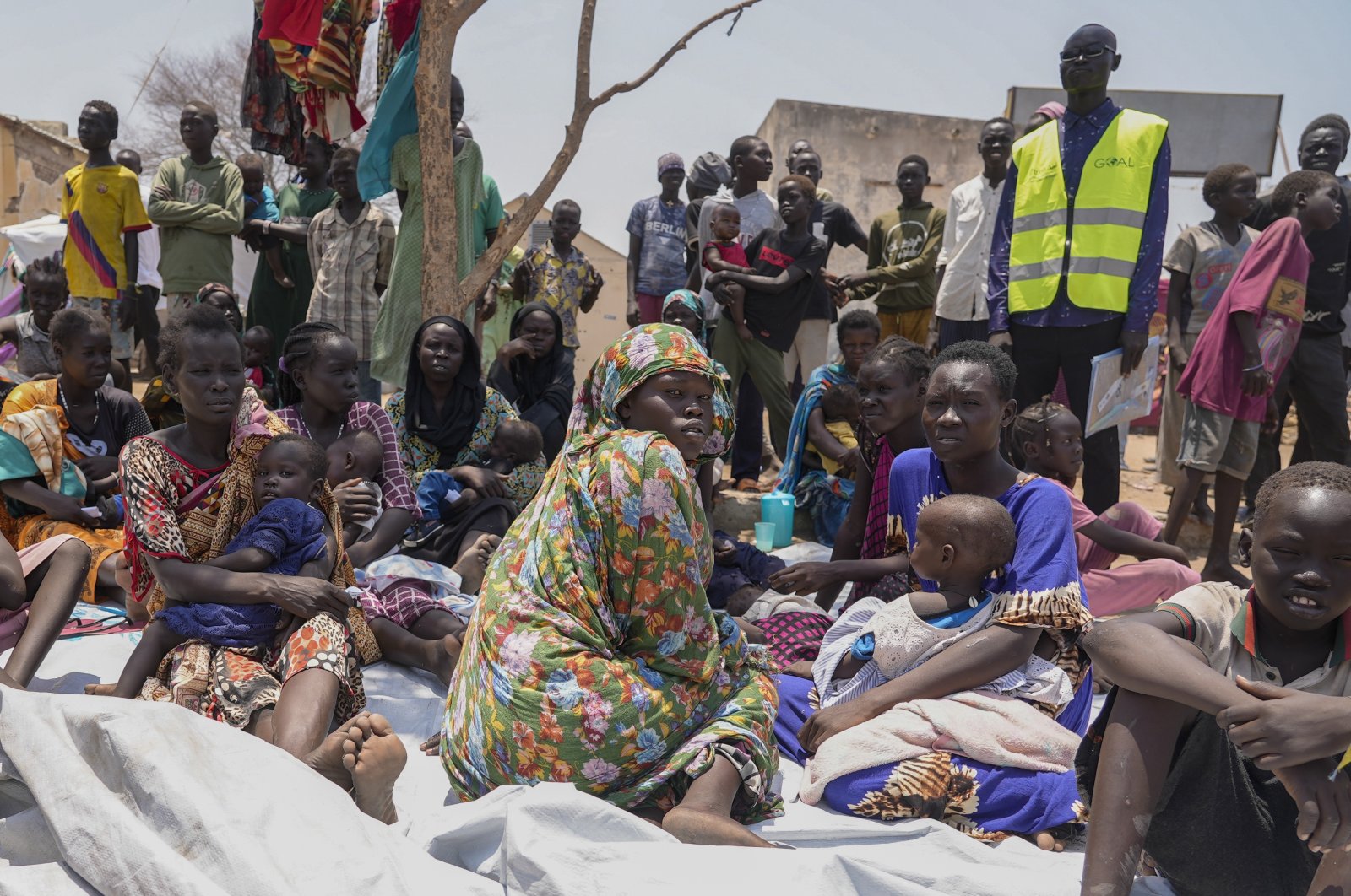 South Sudanese who fled from Sudan sit outside a nutrition clinic at a transit center in Renk, South Sudan, May 16, 2023. (AP Photo)