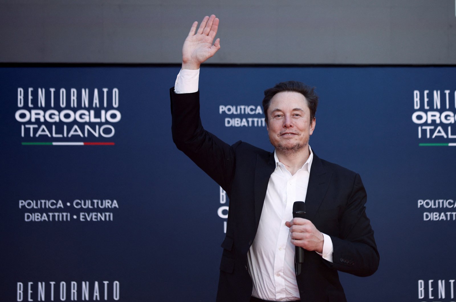 Tesla and SpaceX&#039;s CEO Elon Musk gestures, as he attends the political festival Atreju organized by Italian Prime Minister Giorgia Meloni&#039;s right-wing Brothers of Italy party, Rome, Italy, Dec. 16, 2023. (Reuters Photo)