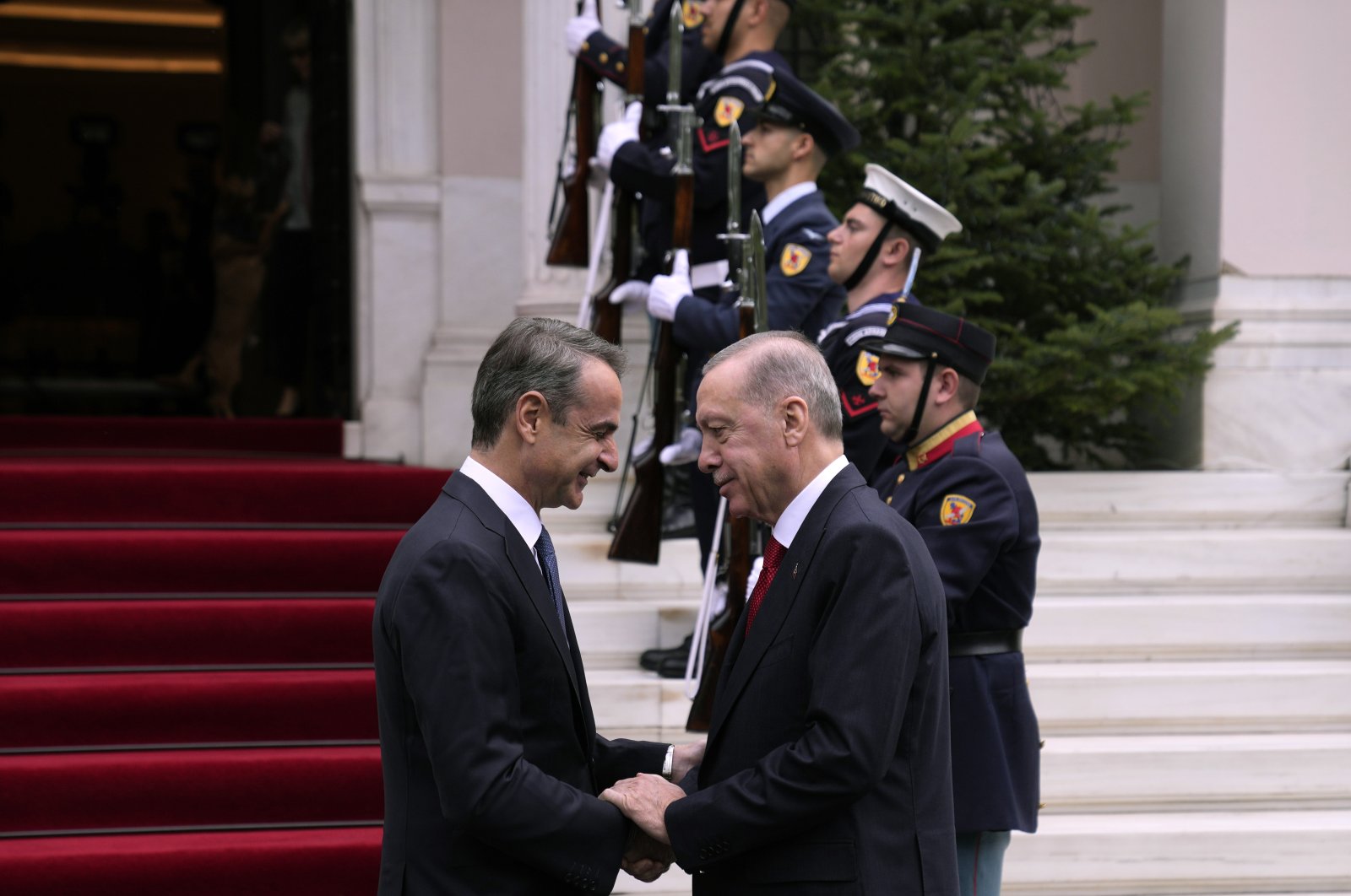 Greece&#039;s Prime Minister Kyriakos Mitsotakis (L) welcomes President Recep Tayyip Erdoğan before their meeting at Maximos Mansion in Athens, Greece, Dec. 7, 2023. (AP Photo)