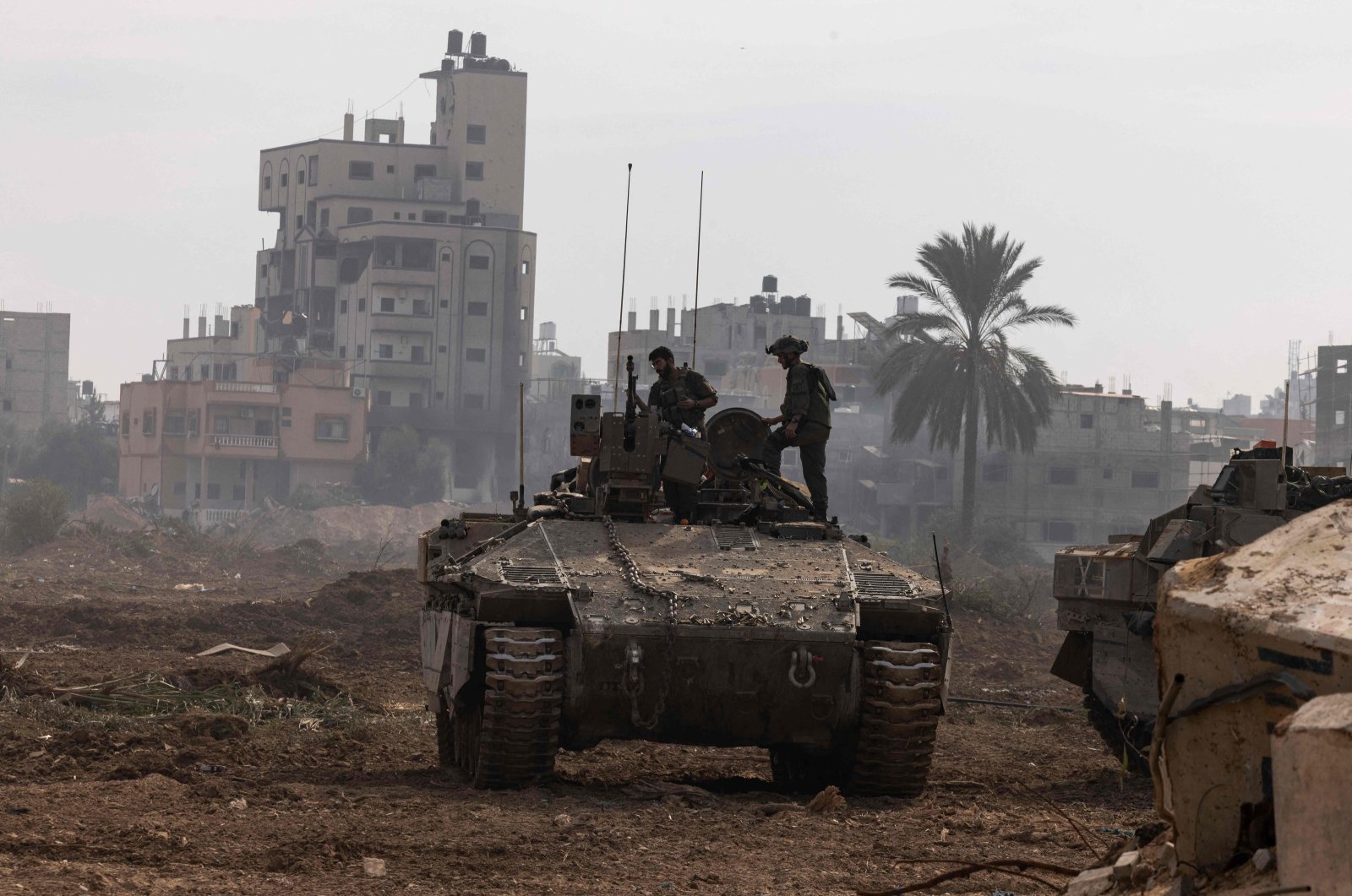 This picture taken during a media tour organized by the Israeli military on Jan. 8, 2024, shows troops operating in the area of al-Bureij in the central Gaza Strip. (AFP File Photo)