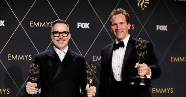 David Furnish (L) and Luke Lloyd Davies, winners of Outstanding Variety Special (Live) for "Elton John Live: Farewell From Dodger Stadium," at the 75th Primetime Emmy Awards at Peacock Theater, Los Angeles, California, U.S., Jan. 15, 2024. (AFP Photo)