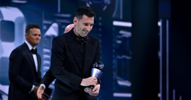 Lionel Messi (R ) with his trophy after being named The Best FIFA Mens Player during The Best FIFA Football Awards 2022 at Salle Pleyel, Paris, France, Feb. 27, 2023. (Getty Images Photo)