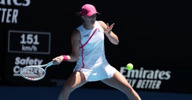 Poland&#039;s Iga Swiatek hits a return against USA&#039;s Sofia Kenin during their women&#039;s singles match on Day 3 of the Australian Open tennis tournament, Melbourne, Australia, Jan. 16, 2024. (AFP Photo)