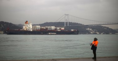A cargo ship crosses the Bosporus Strait toward the Marmara Sea, in Istanbul, Türkiye, March 1, 2022. (AP Photo)