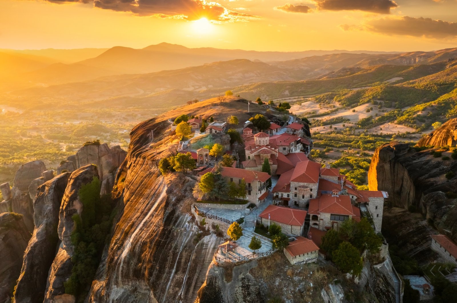 Majestic mountains home to a monastery in Meteora during a sunset in Greece. (Getty Images Photo)