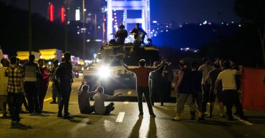 People take over a tank hijacked by FETÖ infiltrators during the coup attempt in Istanbul, Türkiye, July 16, 2016. (AFP Photo)