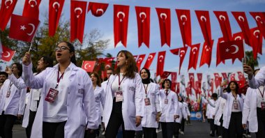 Medicine university students take part in a parade during celebrations marking the 100th anniversary of the creation of the Turkish Republic, in Istanbul, Türkiye, Oct. 29, 2023. (AP Photo)
