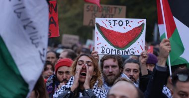 People wave Palestinian flags and hold a picture of a watermelon as they gather for a "Global South United" protest to demand freedom for Palestine, Berlin, Germany, Oct. 28, 2023. (Getty Images Photo)