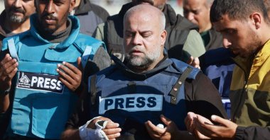 Al Jazeera's Gaza bureau chief Wael al-Dahdouh (C) prays during the funeral of his son, Rafah, Gaza, Palestine, Jan. 7, 2024. (AFP Photo)
