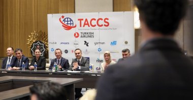 Industry and Technology Minister Mehmet Fatih Kacır (C) applauds during a business event in Orlando, Florida, U.S., Jan. 17, 2024. (AA Photo)