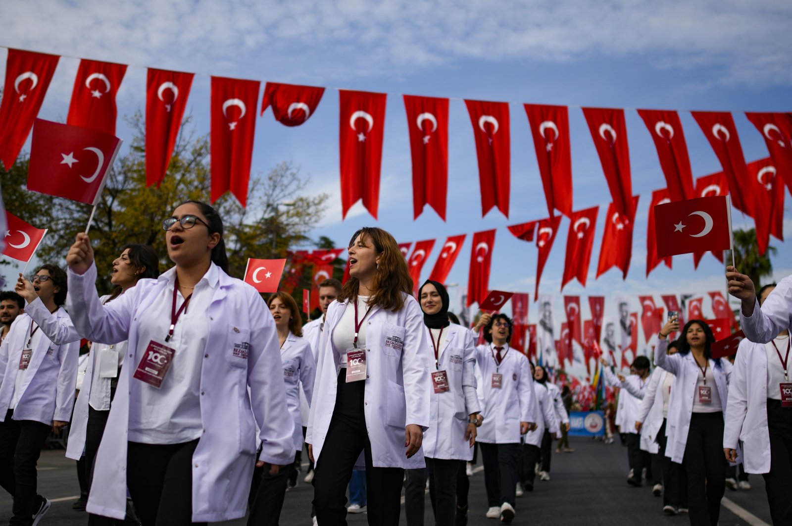 Medicine university students take part in a parade during celebrations marking the 100th anniversary of the creation of the Turkish Republic, in Istanbul, Türkiye, Oct. 29, 2023. (AP Photo)