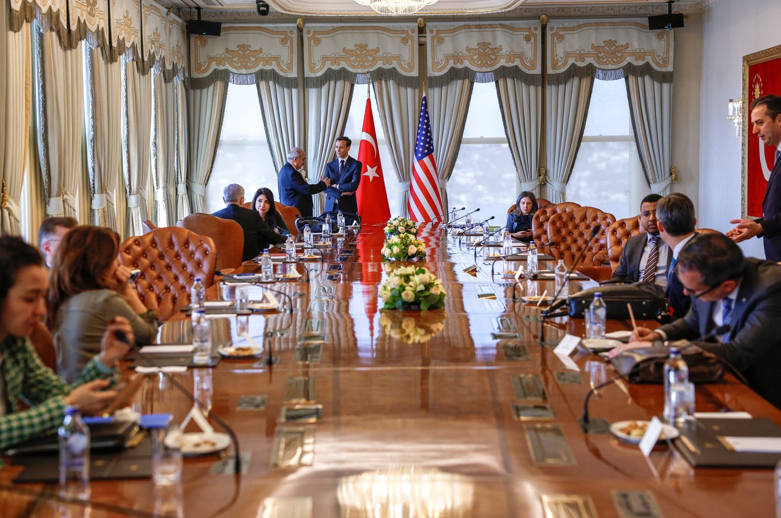U.S. Department of State officials sit at a table, at Vahdettin Mansion, a private residence of the Turkish Presidency, in Istanbul, Türkiye, Jan. 6, 2024. (Reuters Photo)