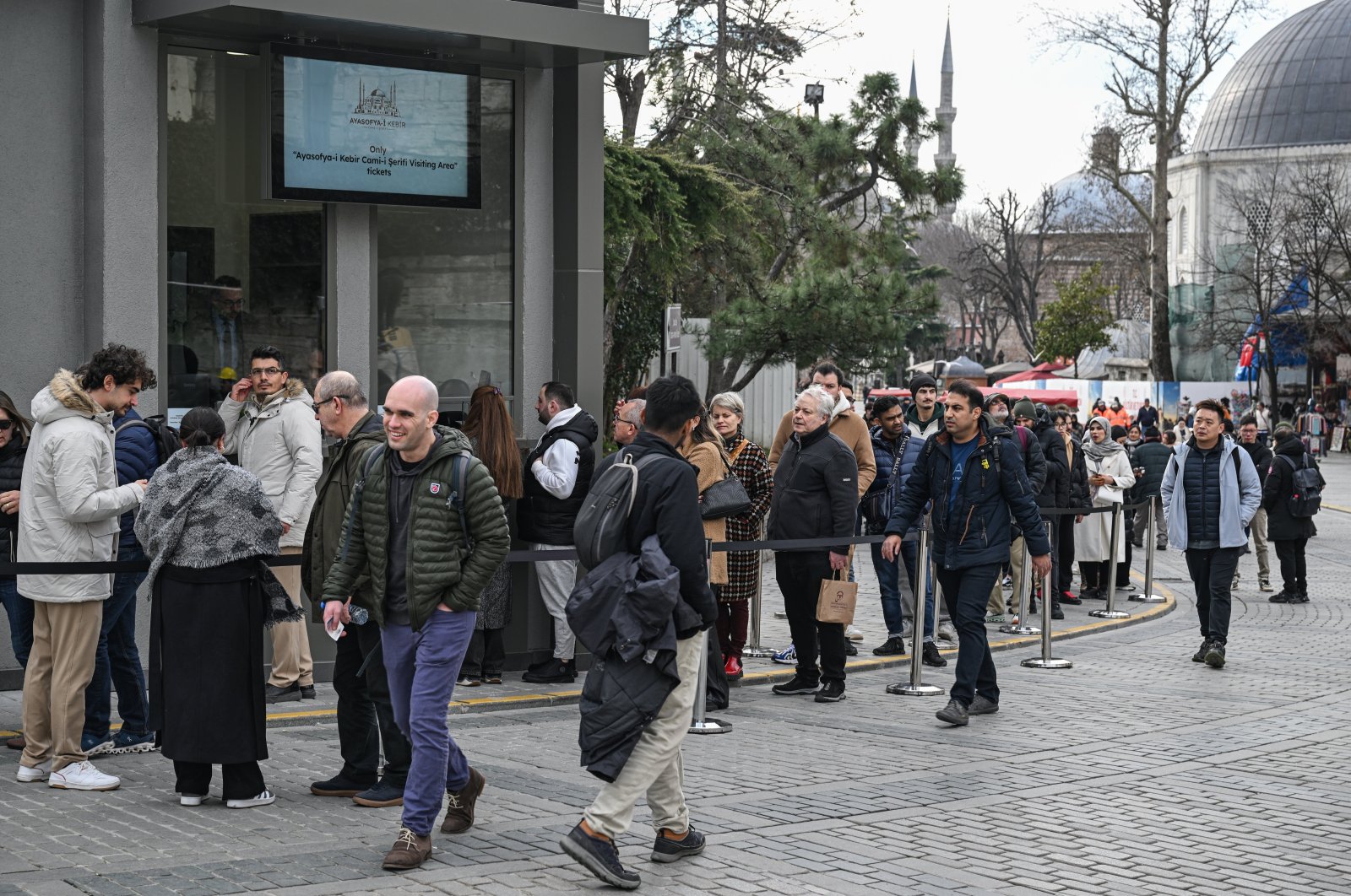Foreign tourists stand in line for tickets to the Hagia Sophia Grand Mosque, Istanbul, Türkiye, Jan. 15, 2024. (AA Photo)
