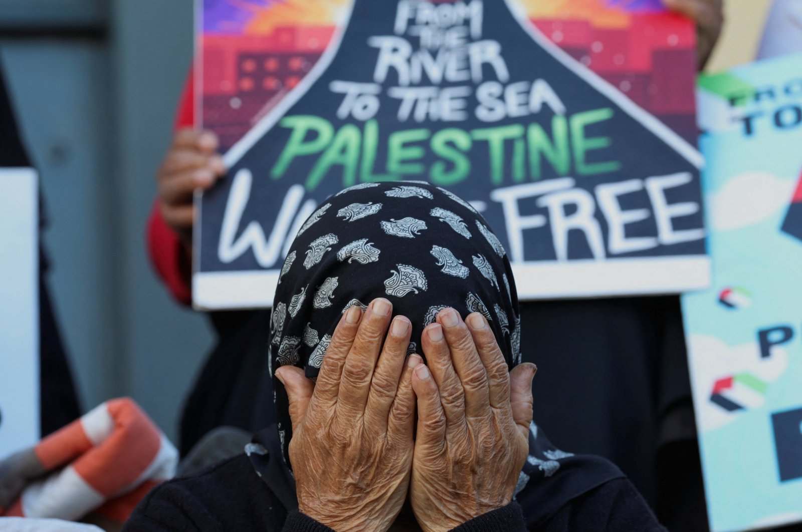 A woman reacts during an interfaith prayer service in Bo-Kaap for the success of the South African Government&#039;s genocide case, which accuses Israel of genocide in the Gaza war, at the International Court of Justice in the Hague, in Cape Town, South Africa, Jan. 10, 2024. (Reuters Photo)