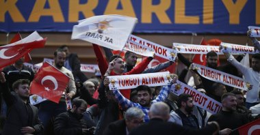 Supporters hold AK Party banners, Turkish flags and banners with names of candidates, at an event in the capital Ankara, Türkiye, Jan. 18, 2024. (AA Photo)