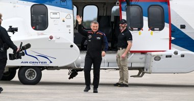 Türkiye&#039;s first space traveler Alper Gezeravcı waves to family members as he arrives at the Kennedy Space Center, Florida, the U.S., Jan. 18, 2023. (AA Photo)