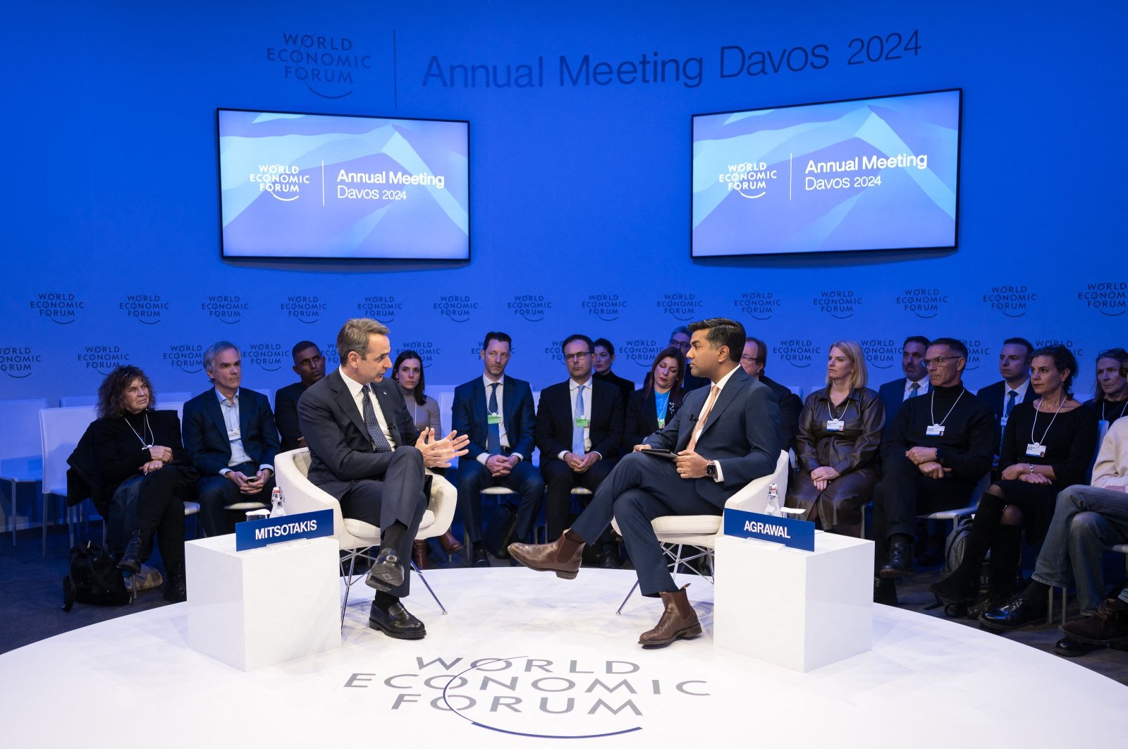 Greek Prime Minister Kyriakos Mitsotakis (L) speaks with editor-in-chief of Foreign Policy magazine Ravi Agrawal during a session of the World Economic Forum, Davos, Switzerland, Jan. 18, 2024. (AFP Photo)