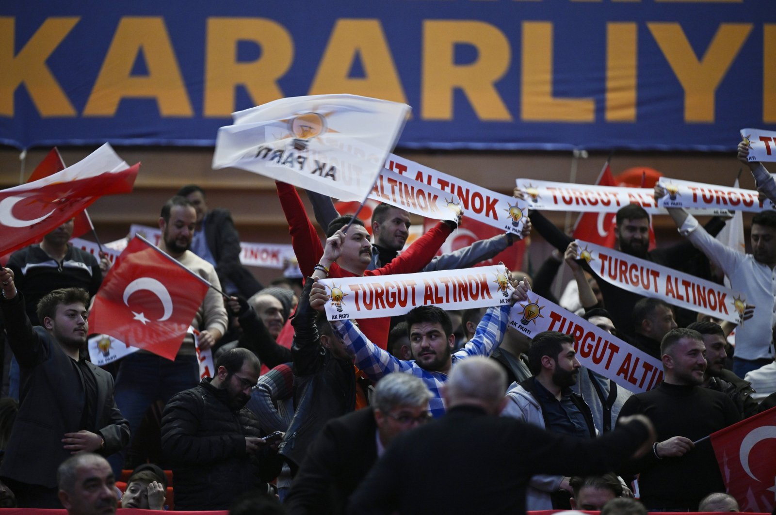 Supporters hold AK Party banners, Turkish flags and banners with names of candidates, at an event in the capital Ankara, Türkiye, Jan. 18, 2024. (AA Photo)