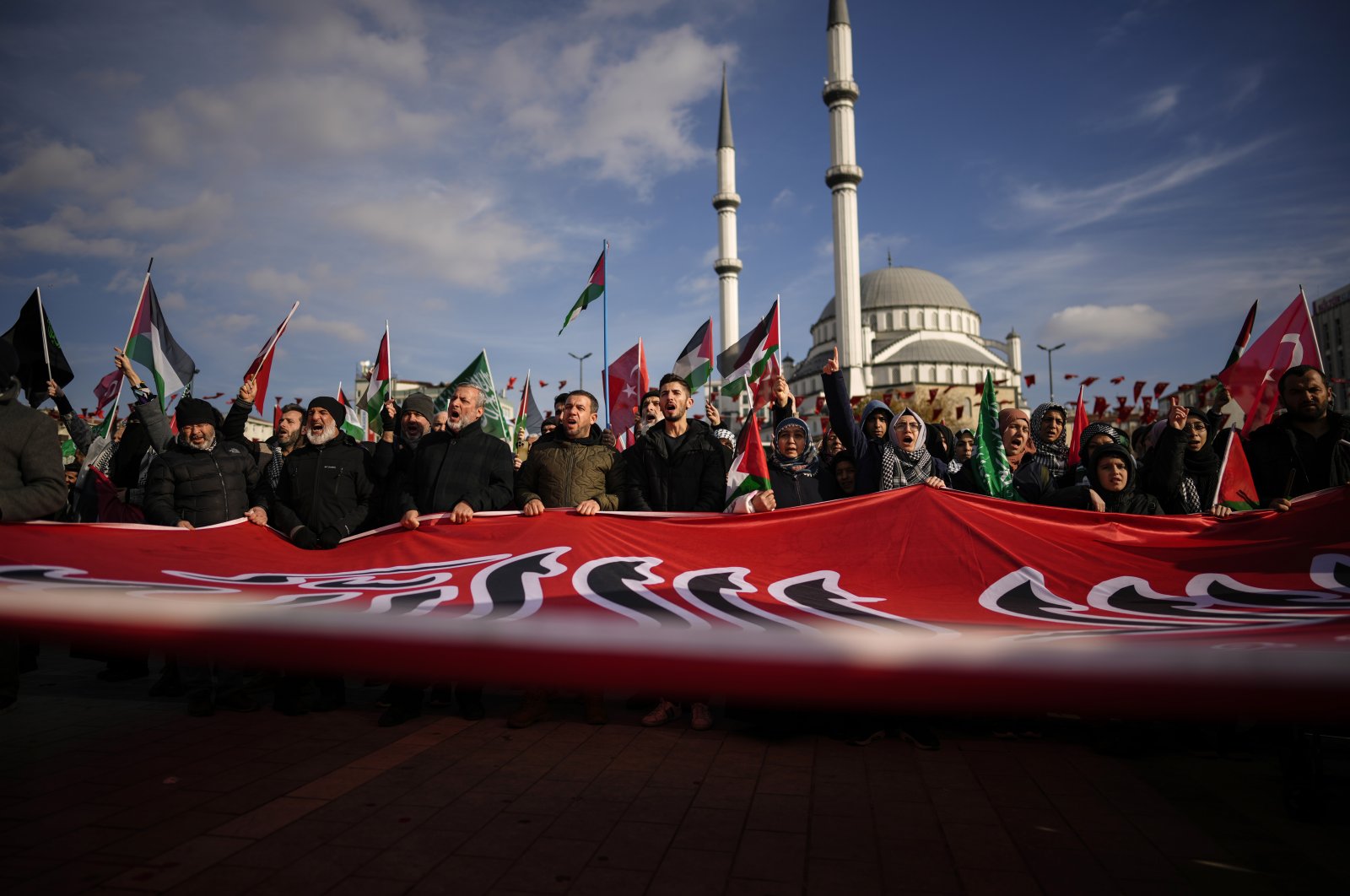 People shout slogans during a protest in support of Palestinians and calling for an immediate ceasefire in Gaza, in Istanbul, Türkiye, Jan. 14, 2024. (AP Photo)