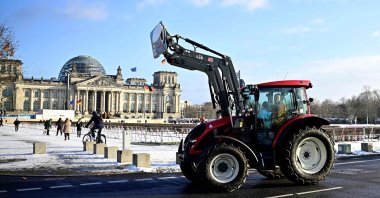 Farmers drive their tractors near the Reichstag building during a protest under the title "We are fed up with agricultural industry" against industrial food production, Berlin, Germany, Jan. 20, 2024. (AFP Photo)