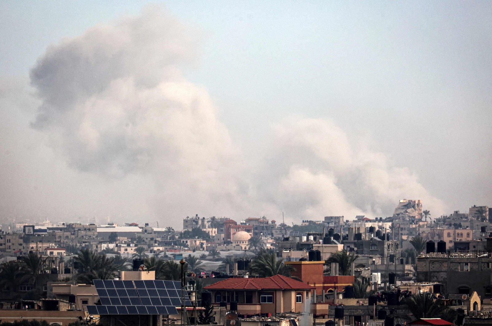 A picture taken from Rafah shows smoke billowing over Khan Yunis in the southern Gaza Strip, Palestine, Jan. 21, 2024. (AFP Photo)